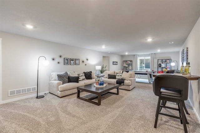 living room featuring light colored carpet