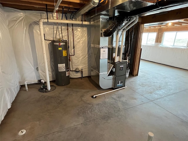 utility room featuring heating unit and water heater