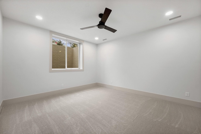 unfurnished room with carpet and ceiling fan