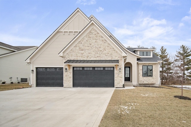 view of front of house featuring cooling unit and a garage