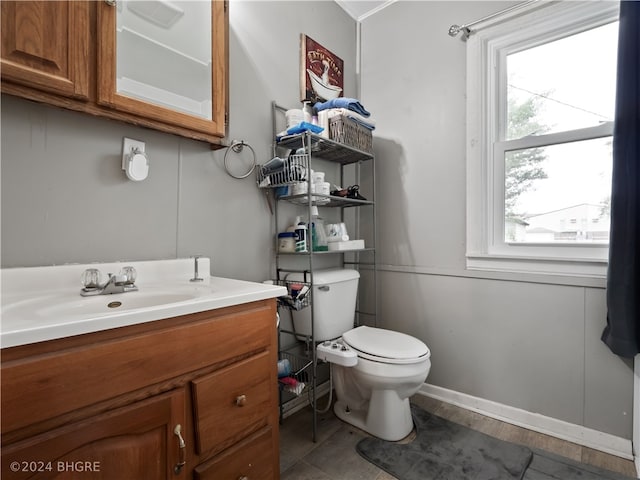 bathroom featuring toilet and vanity