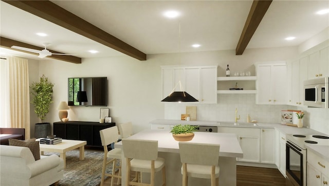 kitchen with stainless steel microwave, ceiling fan, white cabinets, dark wood-type flooring, and range