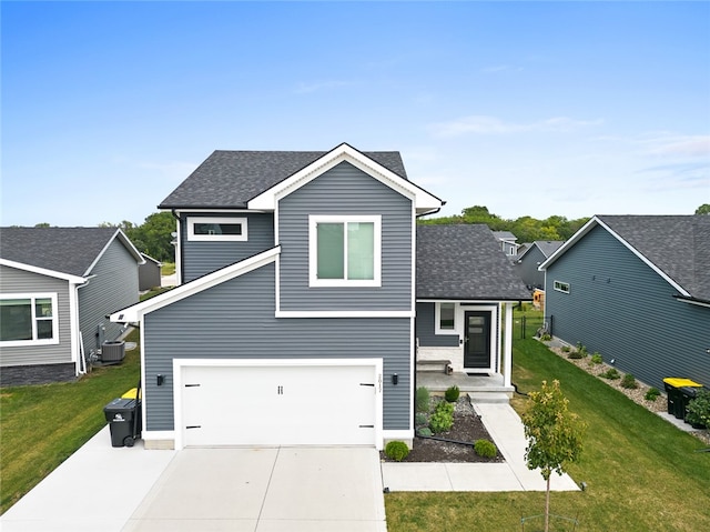 view of front of property featuring a front lawn, central AC unit, and a garage