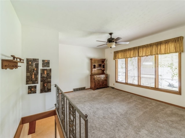 hallway with light carpet