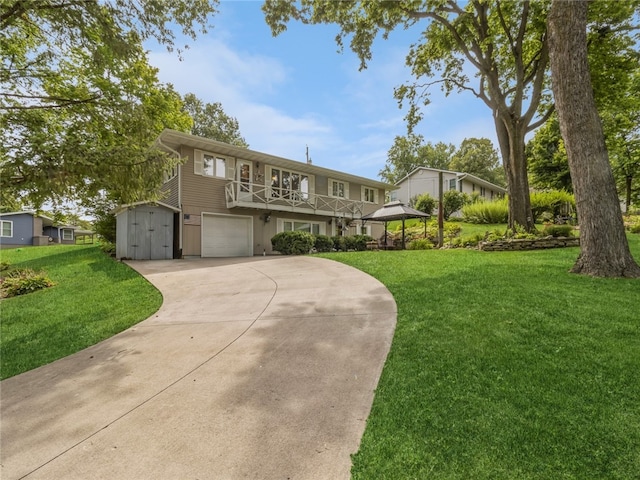 view of front of home with a front yard and a garage