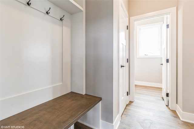 mudroom with light hardwood / wood-style flooring