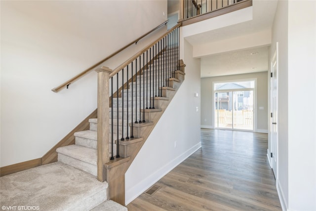 stairway featuring hardwood / wood-style flooring