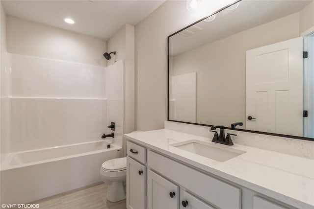 full bathroom with bathtub / shower combination, toilet, and vanity