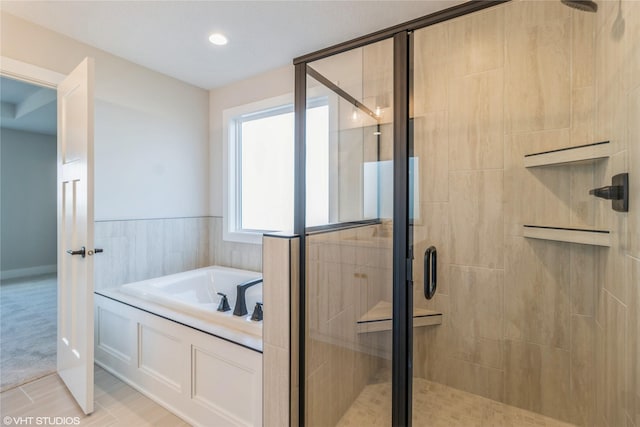 bathroom with tile patterned floors and plus walk in shower