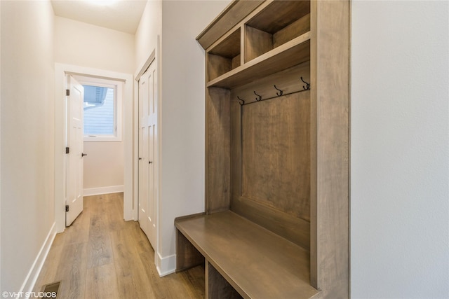 mudroom with light hardwood / wood-style flooring