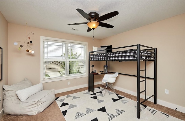 bedroom featuring a textured ceiling