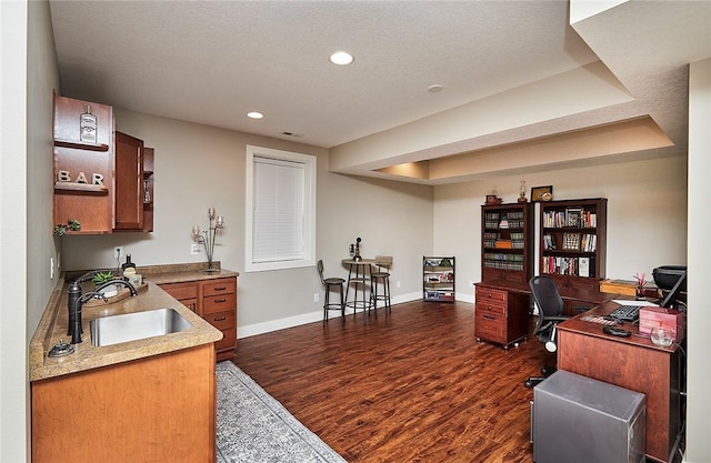 office space with sink, a textured ceiling, and dark hardwood / wood-style floors