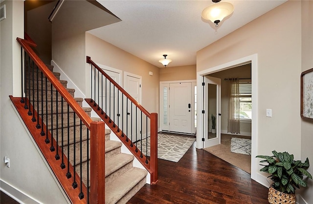 entryway featuring dark wood-type flooring