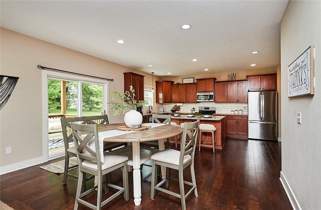 dining room featuring dark hardwood / wood-style flooring