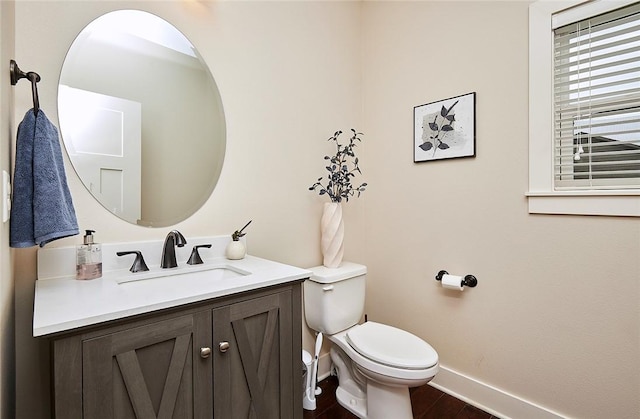 bathroom with vanity, hardwood / wood-style floors, and toilet