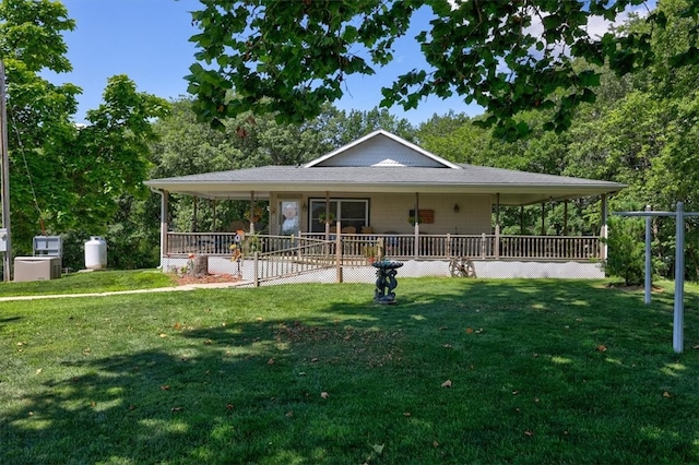 farmhouse with a front yard and covered porch