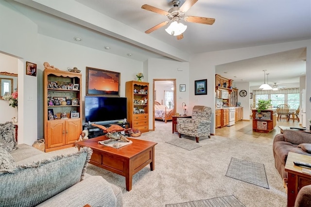 living room with ceiling fan, light tile patterned floors, and lofted ceiling