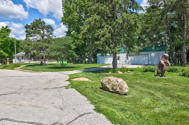 exterior space featuring a yard and a garage