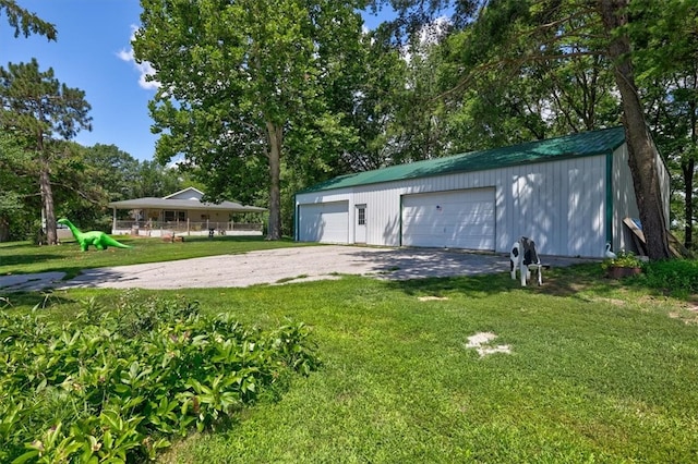 exterior space with a lawn and a garage