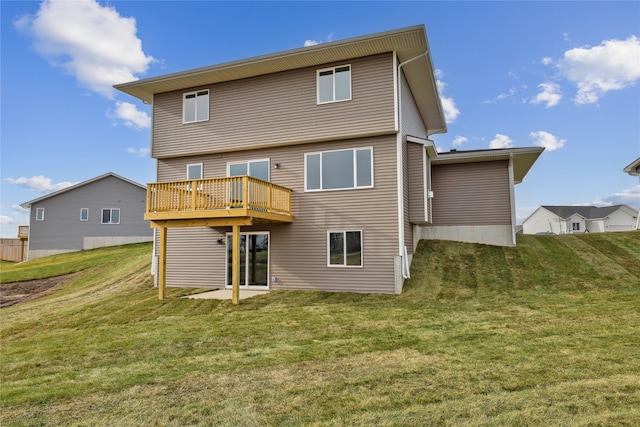 back of house featuring a yard and a wooden deck