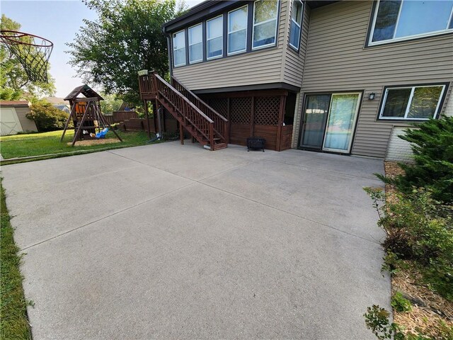 view of property exterior with a playground