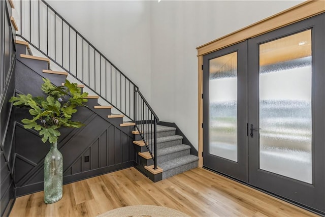 foyer with french doors and wood-type flooring