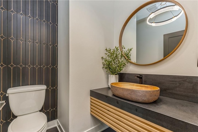 bathroom featuring sink and toilet