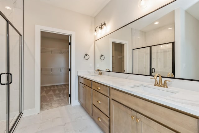 bathroom featuring vanity and an enclosed shower