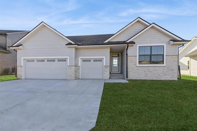 view of front facade with central AC unit, a garage, and a front lawn