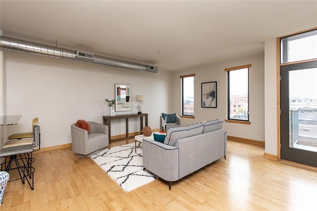 living room with light hardwood / wood-style floors