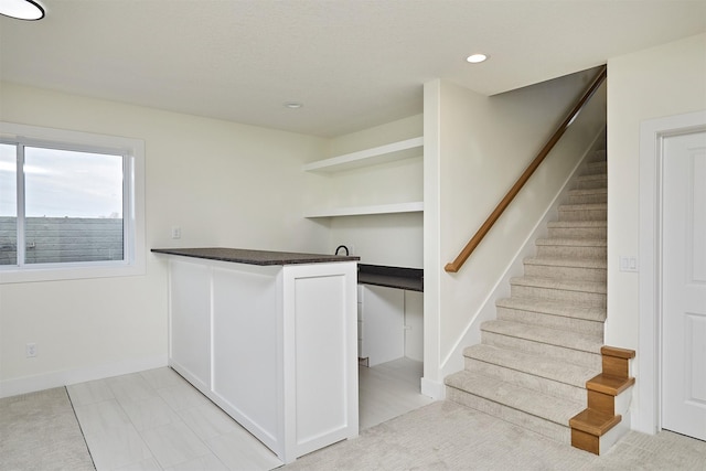 interior space with stairs, baseboards, and recessed lighting