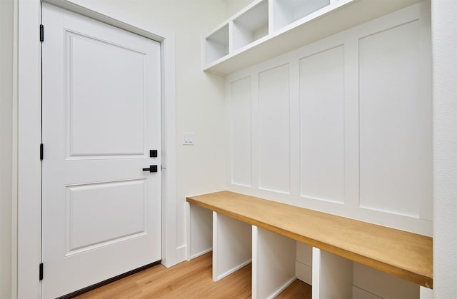 mudroom with light wood-type flooring and baseboards