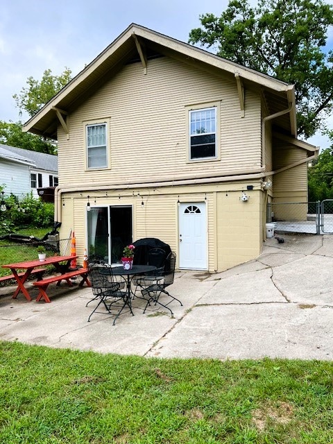 back of house with a patio