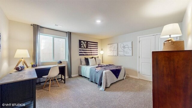 bedroom featuring light carpet