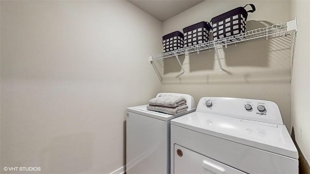 laundry room featuring washer and clothes dryer