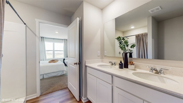 bathroom featuring vanity and wood-type flooring