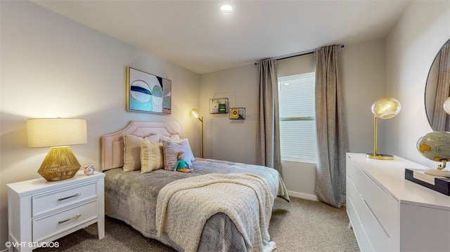 bedroom with light colored carpet