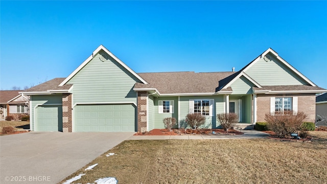 view of front of property with a garage and a front lawn