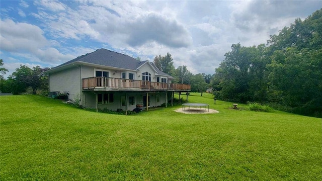 exterior space with a wooden deck and an outdoor fire pit