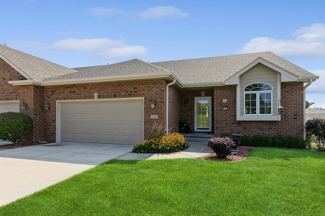 ranch-style home with a garage and a front lawn