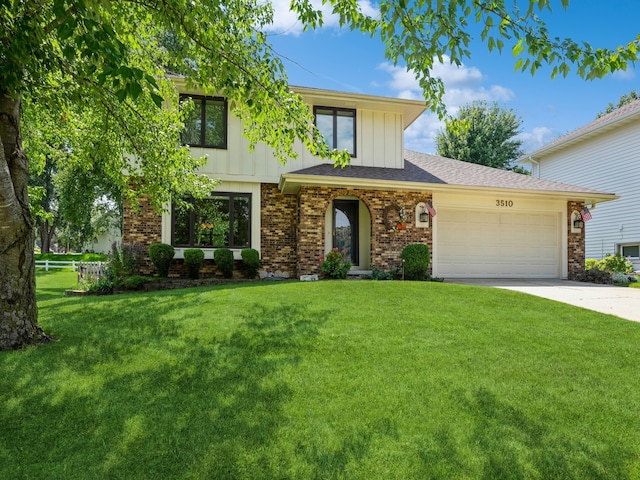 view of front of property featuring a garage and a front yard