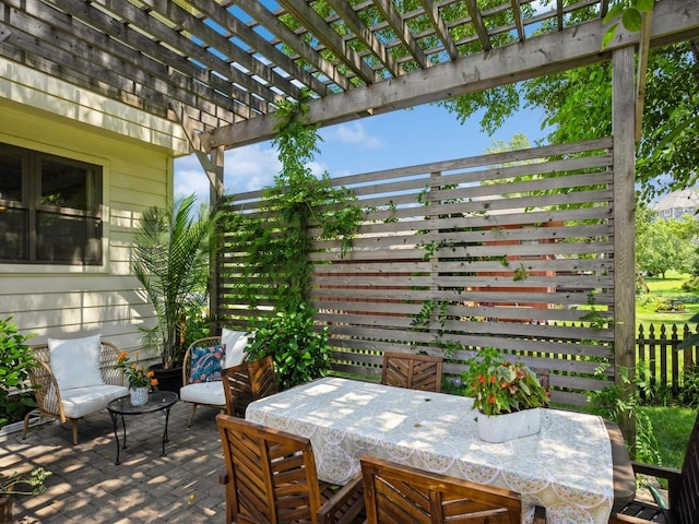 view of patio / terrace with fence, outdoor dining space, and a pergola