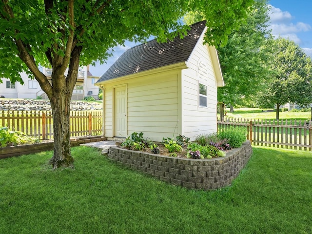 view of outbuilding featuring an outbuilding and a fenced backyard