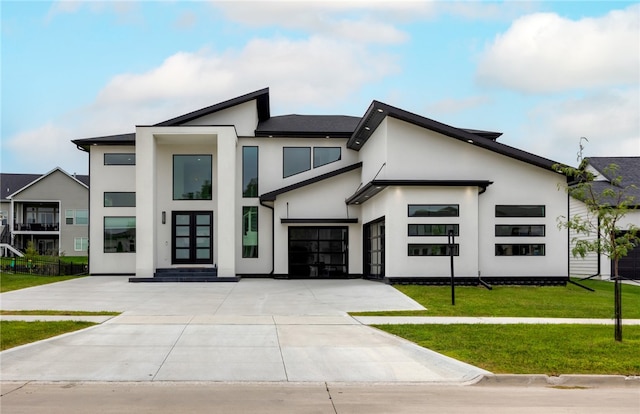 contemporary home featuring a front yard