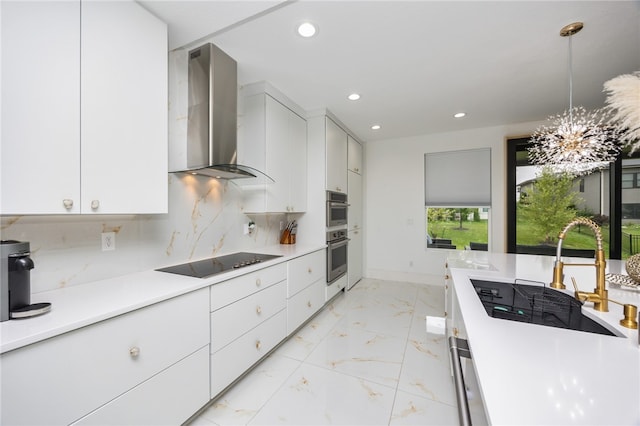 kitchen featuring black electric cooktop, white cabinetry, wall chimney exhaust hood, tasteful backsplash, and light tile patterned floors