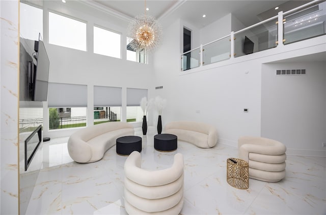 living room featuring ornamental molding, light tile patterned flooring, an inviting chandelier, and a towering ceiling