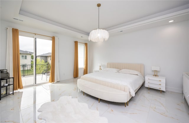 tiled bedroom featuring a tray ceiling and access to exterior