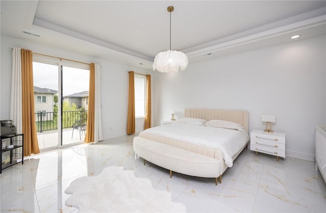 bedroom with marble finish floor, a notable chandelier, access to exterior, and a raised ceiling