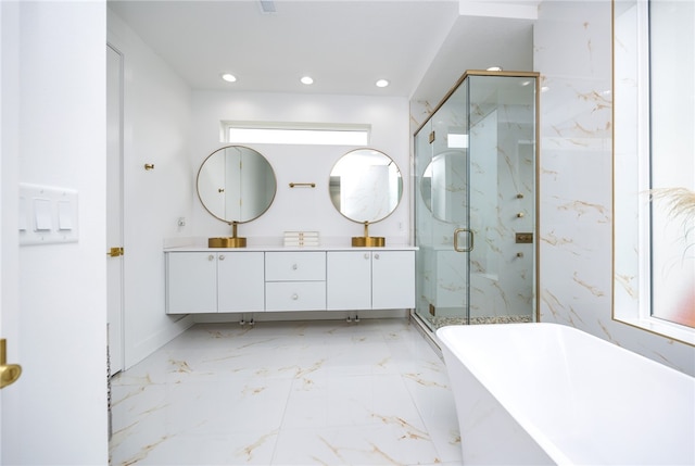 bathroom with tile patterned flooring, plenty of natural light, plus walk in shower, and dual vanity