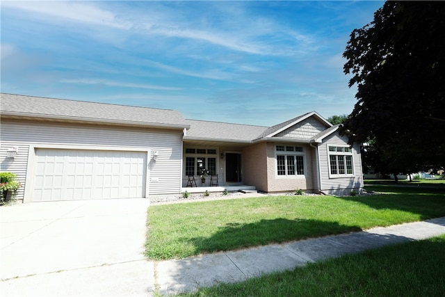 ranch-style home featuring a front yard and a garage